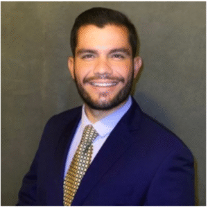 A professional headshot of Dr. Rodrigo Alterio, surgeon and co-author of The Home Doctor guide.