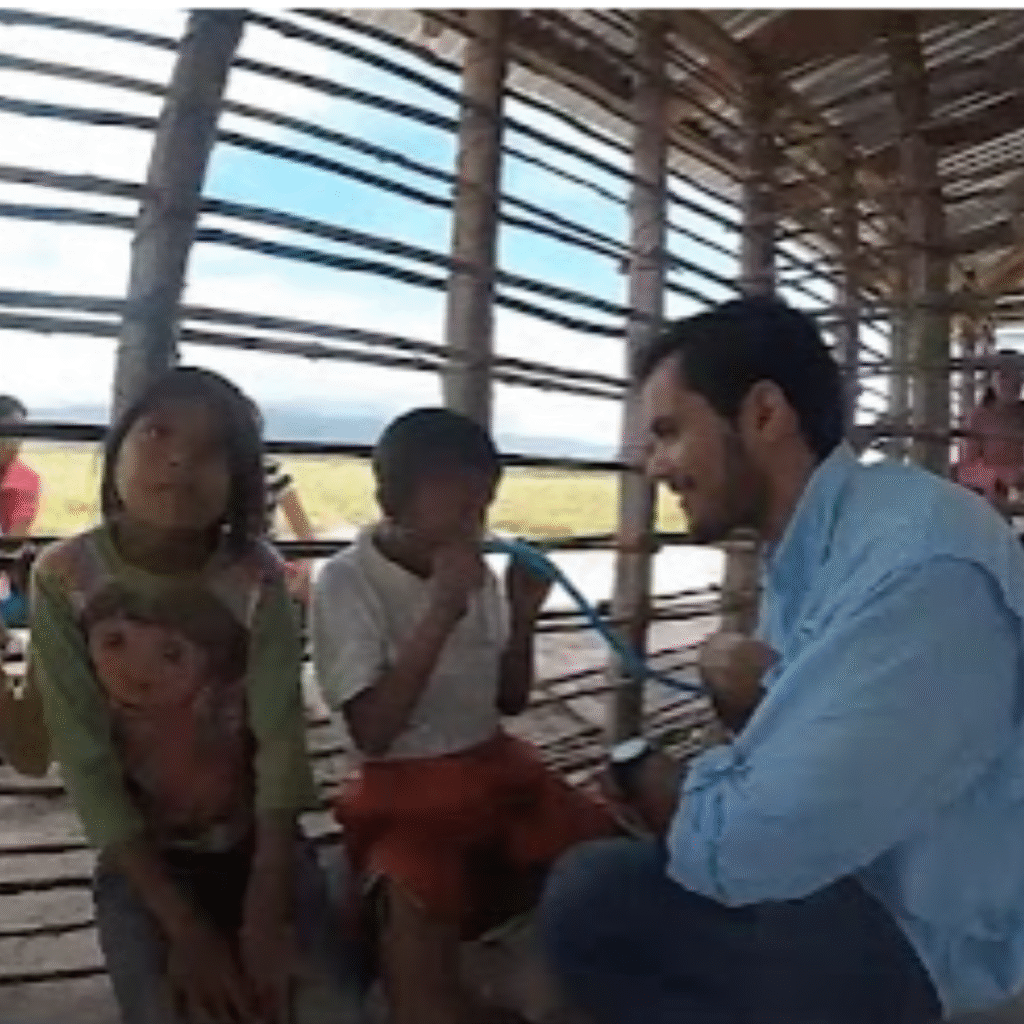 Dr. Rodrigo Alterio, co-author of The Home Doctor, providing medical care to children from the Pemons community in the Amazon jungle.